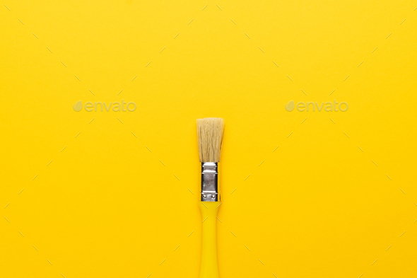 Paint Brush on The Yellow Background Stock Photo by garloon | PhotoDune